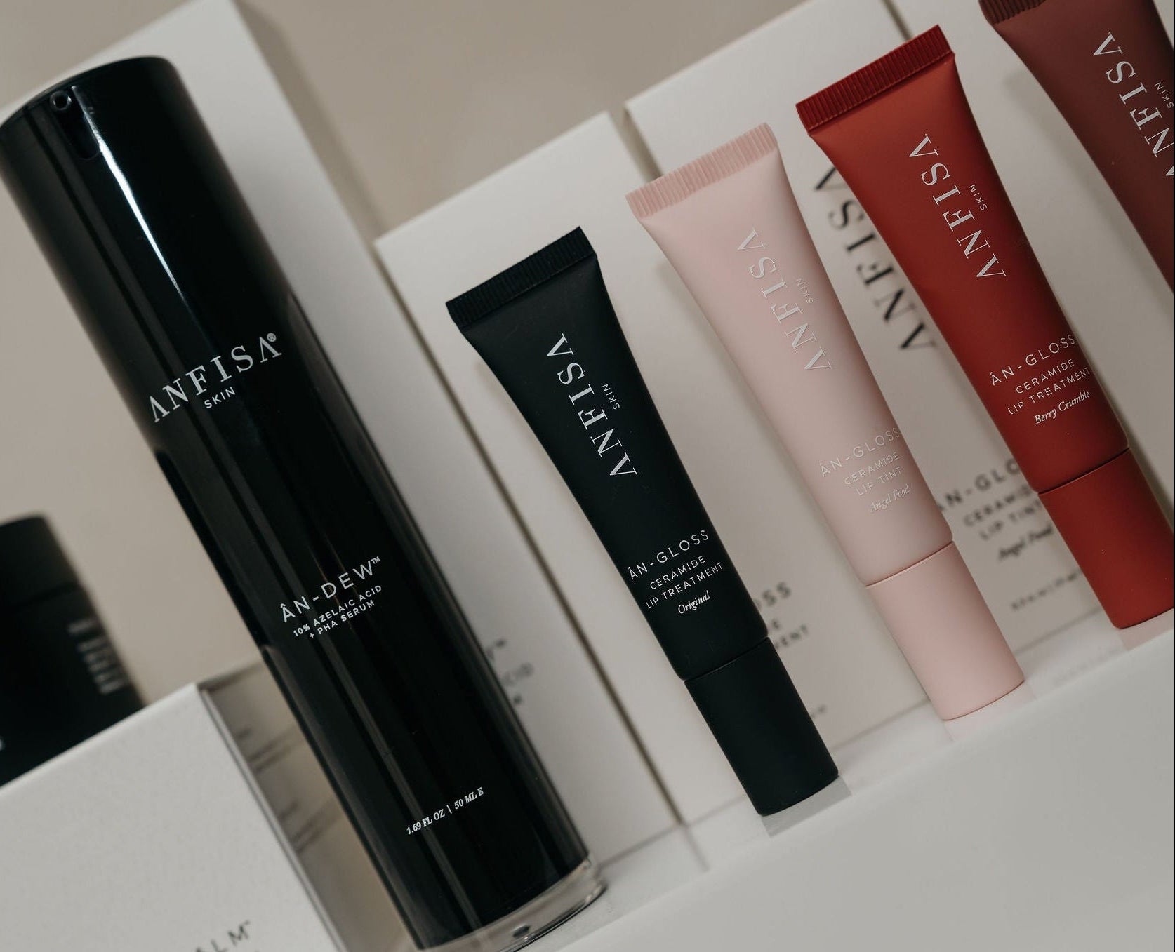 Set of skincare products with 'ANFISA' branding on a neutral background