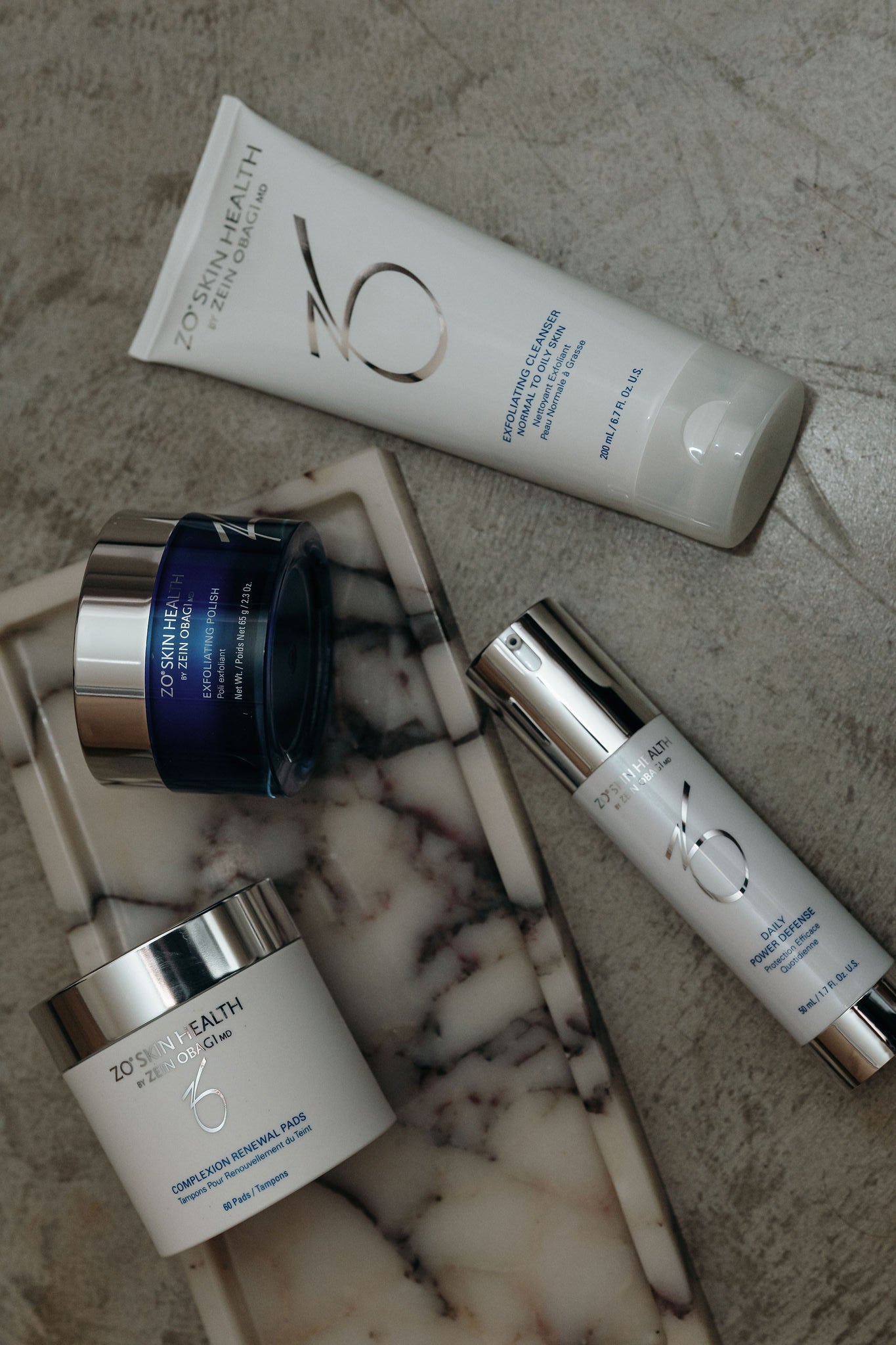 Zo Skin Health skincare products on a marble surface